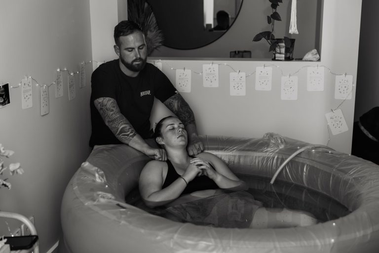 Birth photography — newborn baby moments after delivery